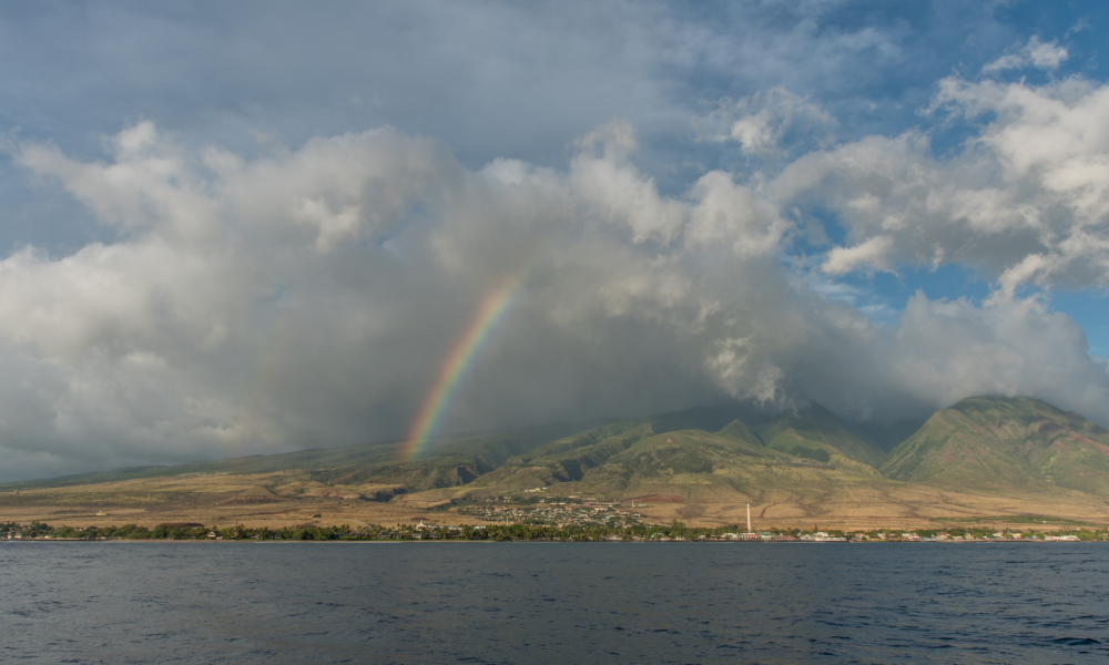 Scenic ocean view of mountains and clouds