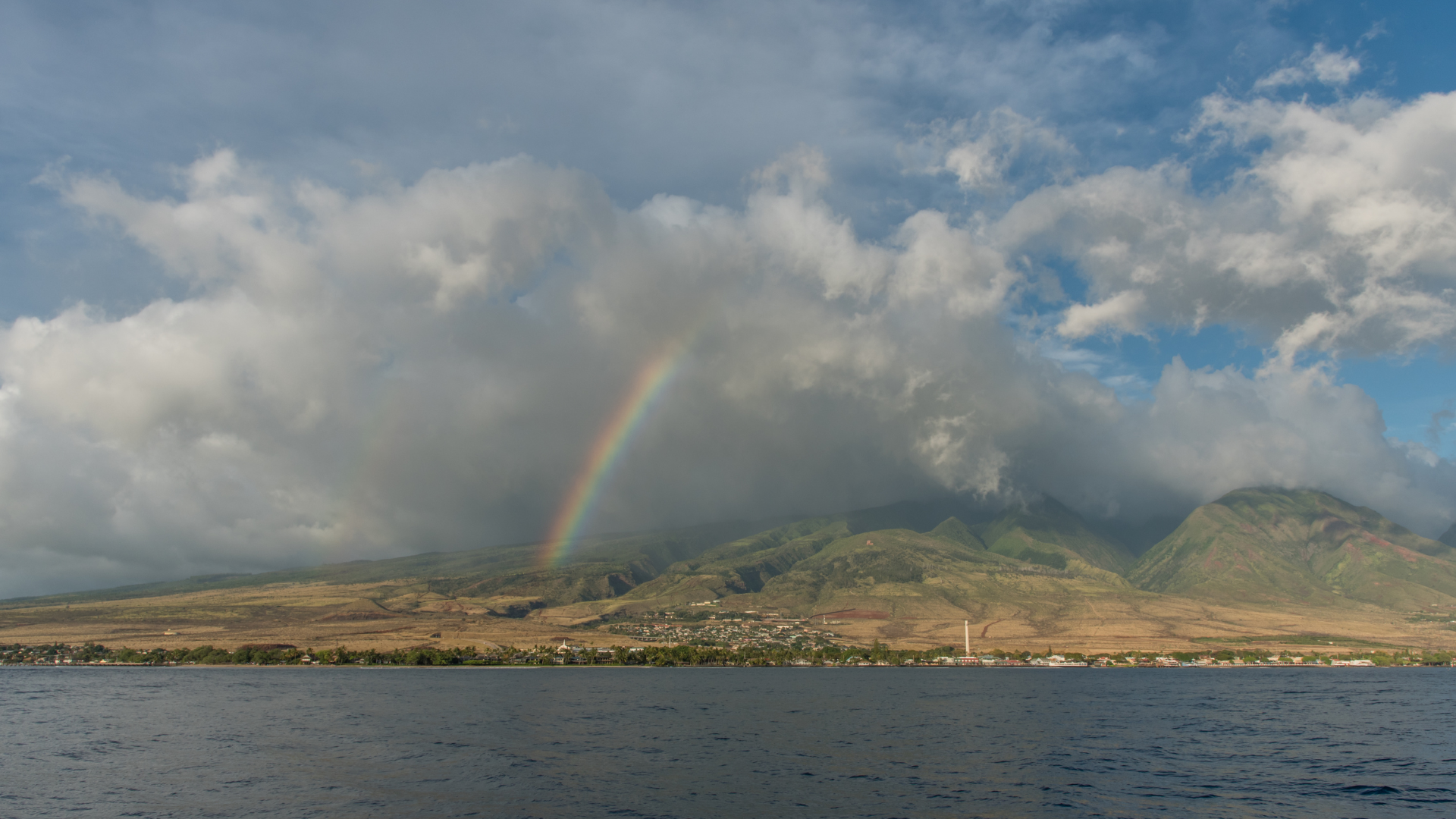 Scenic ocean view of mountains and clouds